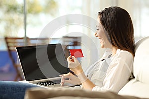 Woman paying on line with a credit card