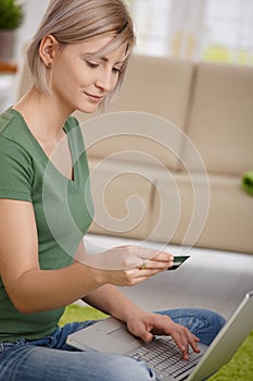 Woman paying online with credit card