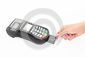 Woman pays with credit card via POS terminal in shop. Modern technologies and electronic payment concept. Hand swips magnetic card