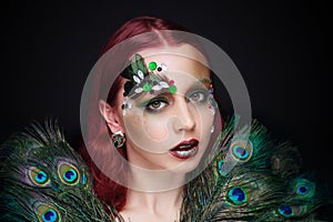 Woman with peacock feathers