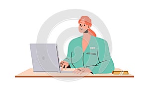 Woman pediatrician in lab coat working on laptop sitting at table isolated on white background