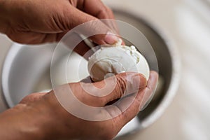 Woman Peeling Hard Boiled Eggs
