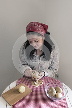 Woman peeling potatoes