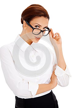 Woman peering over her glasses photo