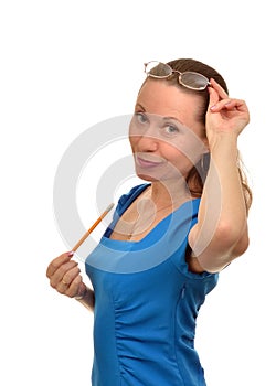 Woman with pencil in hand trying on glasses