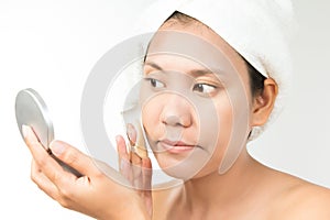 Woman with perfect health skin of face and bath towel on head