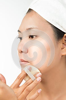 Woman with perfect health skin of face and bath towel on head