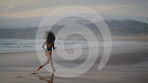 Woman performer dancing beach at summer twilight. Girl performing contemporary.