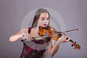 Woman performer with violin in studio