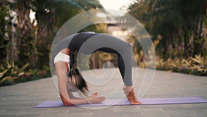 Woman performing advanced yoga practice