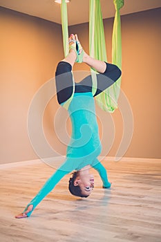 Woman performing antigravity yoga