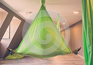 Woman performing antigravity yoga