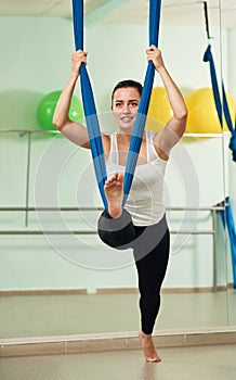 Woman performing antigravity yoga