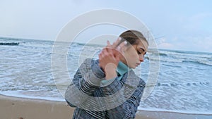 A woman performing dance improvisation at the seacoast