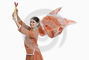 Woman performing Dandiya Raas on Navratri