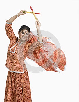 Woman performing Dandiya Raas on Navratri