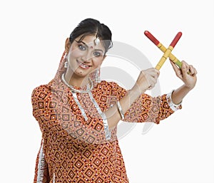 Woman performing Dandiya Raas on Navratri