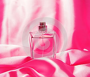 Woman perfume on pink