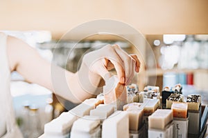 Woman with personal hygiene items in zero waste shop