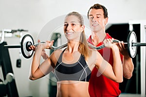 Woman with Personal Trainer in gym