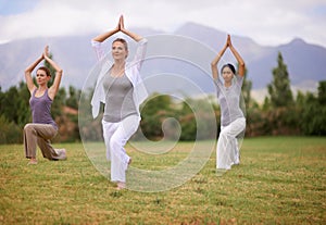 Woman, personal trainer and yoga on field for spiritual wellness, namaste or wellbeing in nature. Female person or