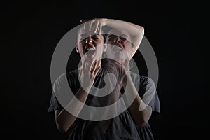 Woman with personality disorder on dark background, double exposure