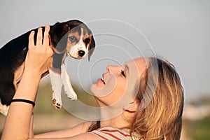 Woman with pet beagle dog