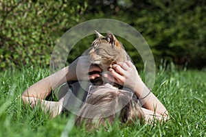 Woman petting cat in the garden