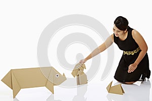 Woman petting a paper dog