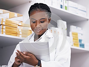 Woman, pharmacist or tablet, online checklist and checking stock of medicine on shelf. African female medical