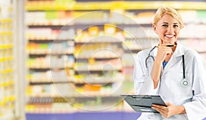 Woman pharmacist working at pharmacy.