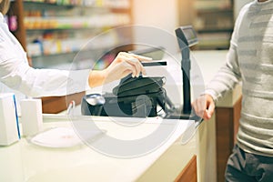 Woman at the pharmacy purchasing medicines