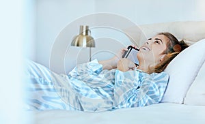 Woman, phone call and bed in the morning, happy and conversation. Female, smartphone and girl in bedroom, talking and