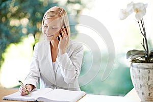 Woman, phone call and receptionist taking notes, smile and listening to contact. Cellphone, notebook and female