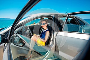 Woman with phone in the car