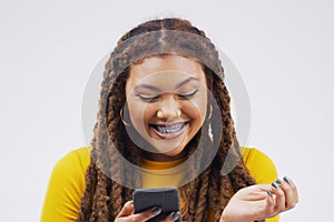 Woman, phone and excited for news in studio, victory notification and lottery success. Female person, reading