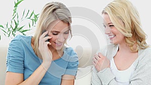 Woman on the phone laughing with a friend