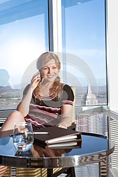 woman with phone  in office environment