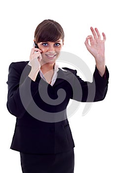 Woman with phone and ok gesture