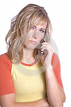 Woman on phone scowling
