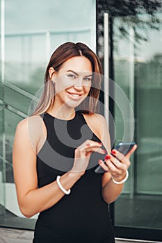 woman with a phone smiling