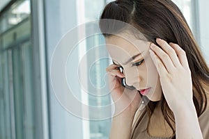 Woman on phone with stress, anxiety, negative feeling