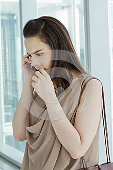 Woman on phone with stress, anxiety, negative feeling