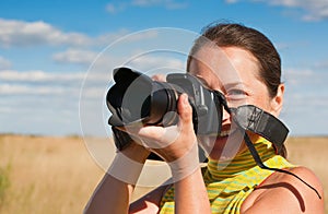 Woman photographer with camera