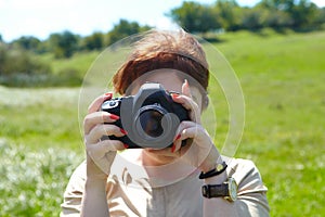 Woman photographer with camera