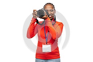 woman photographer with camera and conference id