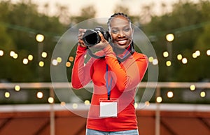 woman photographer with camera and conference id