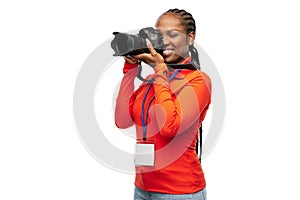woman photographer with camera and conference id