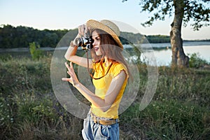 Woman photographer with camera red lips hat walk fresh air