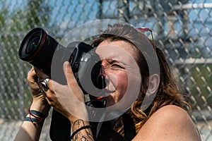 Woman photographer with DSLR camera